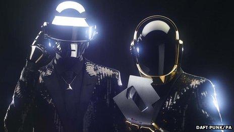 Daft Punk pose with an Official Charts Company number one trophy