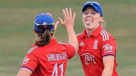 Heather Knight of England celebrates catching Jodie Fields of Australia with team mate Anya Shrubsole (left)