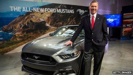 Alan Mulally standing next a Ford car