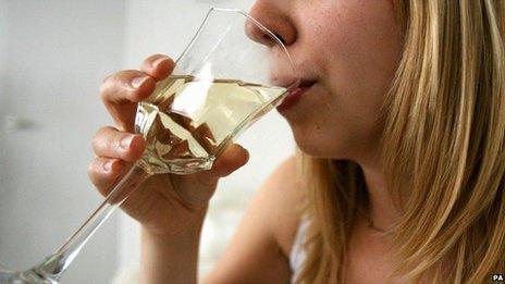 Woman drinking a glass of wine