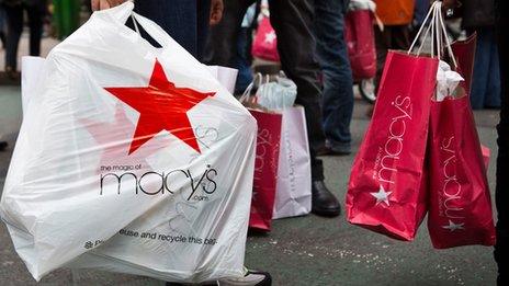 Macy's shopping bags and people walking