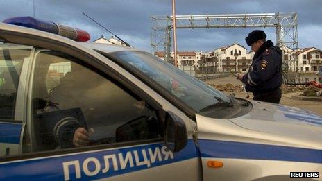 Russian police patrol near accommodation sites and venues in the Olympic Park near Sochi