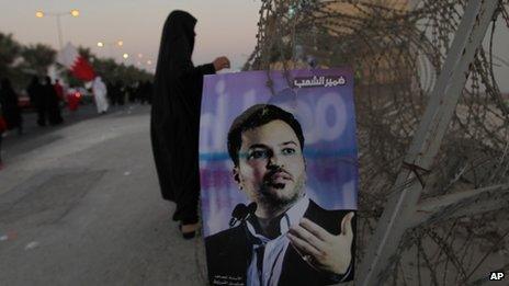 Arabic writing on the poster reads, "Conscience of the people," with a picture of jailed opposition figure Khalil Marzooq in Manama, Bahrain (September 2013)