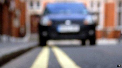 car parked on double yellow lines