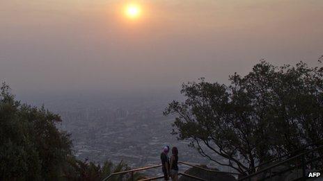 Panoramic view of Santiago mantled by smoke created by multiple fires in southern and central Chile on 8 January, 2014