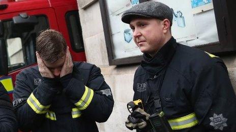 Firefighters stand outside Westminster Fire station after their last shift there