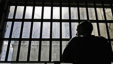 Prisoner looking out of cell window