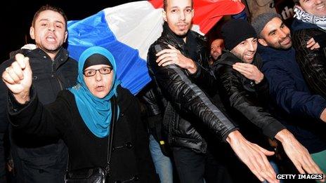 Supporters of the French comic perform his "quenelle" salute