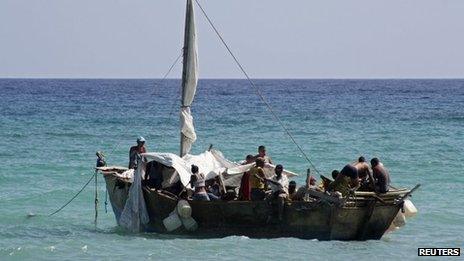 A boat of Cuban migrants floats anchored as they rest on their way from Cuba, May 23, 2013.