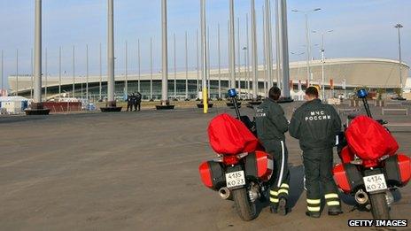 Security personnel stand next to their motorbikes outside the Olympic Park in Sochi (9 January 2014)