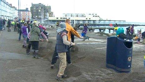 Volunteers clean up at Aberystwyth's storm-damaged seafront