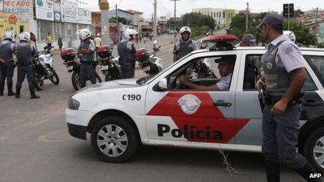 Policemen outside Vida Nova bus station in Campinas