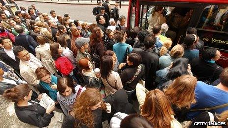 Commuters crowd a bus during a Tube strike