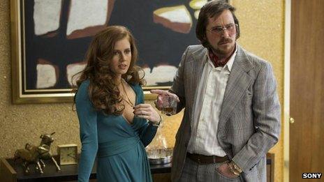 Amy Adams and Christian Bale in American Hustle