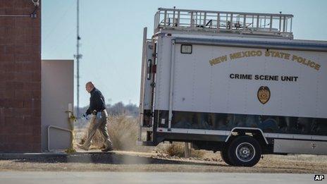 Crime scene investigators enter the gymnasium at Berrendo Middle School, 14 January 2014