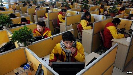 Workers at a delivery company in Beijing