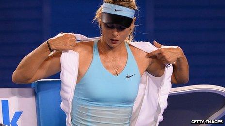 Maria Sharapova puts on an ice vest