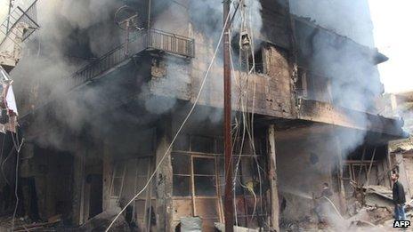 Smoke rises from a damaged building in Daraya, Syria. Photo: 12 January 2014