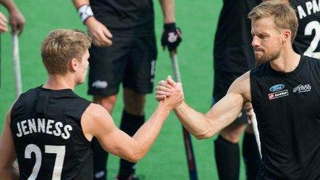 Stephen Jenness shakes hand with a New Zealand team-mate