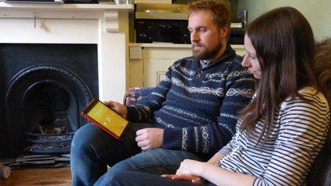 Will and Lydia Moore with tablet