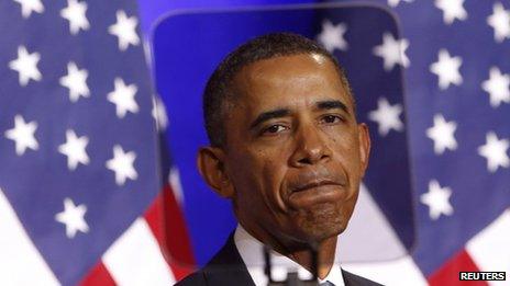 US President Barack Obama is seen through a teleprompter as he speaks at the Justice Department in Washington DC on 17 January 2014