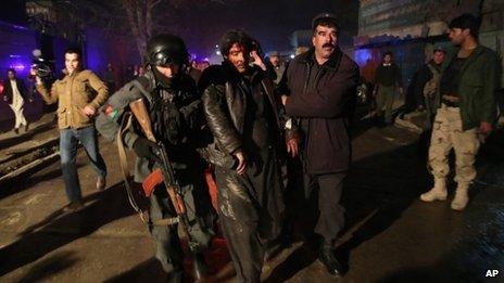 Afghan security forces help an injured man in Kabul. Photo: 17 January 2014