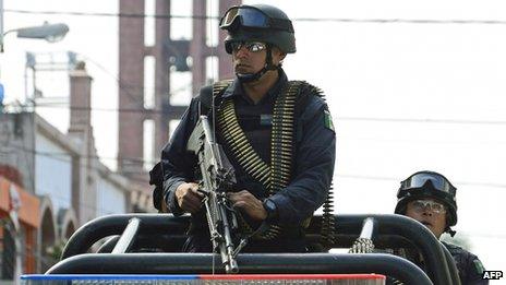 Mexican soldiers patrol the streets of Apatzingan, in Michoacan State, Mexico (January 2014)