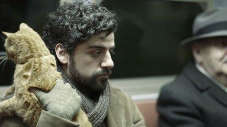 Oscar Isaac and runaway cat in Inside Llewyn Davis