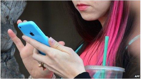 Woman uses a phone (file image)