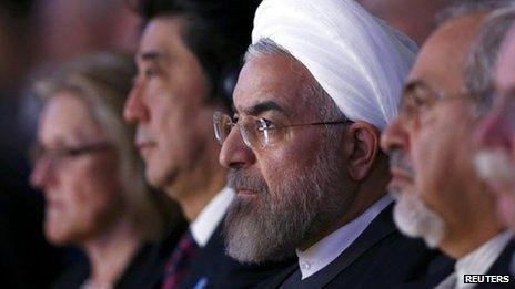 Japan's Prime Minister Shinzo Abe, Iran's President Hassan Rouhani and Iran's Foreign Minister Mohammad Javad Zarif listen to a special address during the annual meeting of the World Economic Forum (WEF) in Davos on 22 January 2014