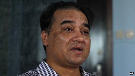 Outspoken Uighur scholar and advocate Ilham Tohti speaks during an interview at his home in Beijing on 5 July 2013