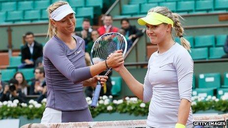 Russia's Maria Sharapova (L) shake hand with Canada's Eugenie Bouchard after winning their French Open match in May 2013