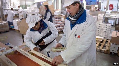 Inspectors of veterinary services and fraud inspect seafood products at the Rungis international market in Rungis, near Paris.