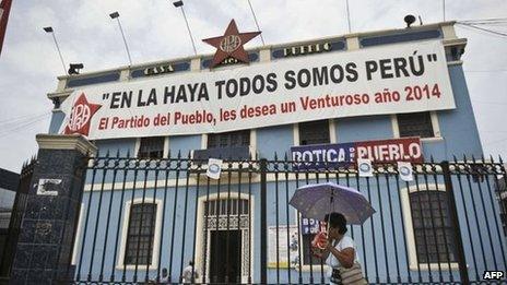 A banner reading "In the Hague we are all Peru" hangs from the headquarters of a political party in Lima on 26 January 2014.