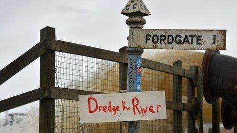 Sign near pumps handling flood water in Somerset