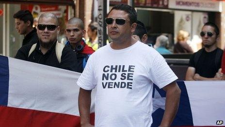 A Chilean nationalists with a T-shirt that reads in Spanish, "Chile is not for Sale", shows his displeasure at the recent world court ruling in Santiago, Chile, Jan. 27, 2014.