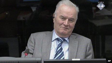 Former Bosnian Serb army commander Gen. Ratko Mladic smiles during his appearance at the Yugoslav war crimes tribunal Tuesday Jan. 28, 2014 in the Hague Netherlands.