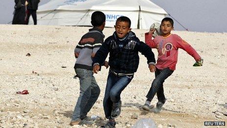 Syrian refugee children play at Al Zaatri refugee camp in the Jordanian city of Mafraq, near the border with Syria