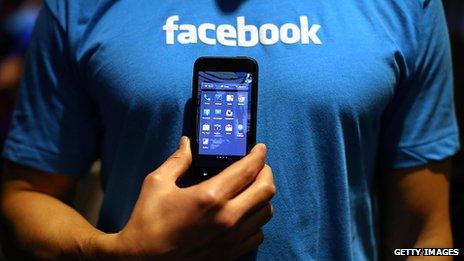 Phone in front of Facebook t-shirt