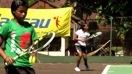 Young Indonesian tennis playing twins Fitriani Sabatini (green, left) and Fitriana Sabrina Mastuti