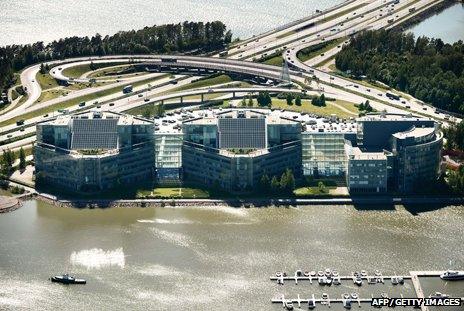 An aerial view of Nokia's headquarters near Helsinki, showing a big building complex surrounded by water