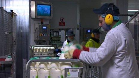 Man loading milk cartons