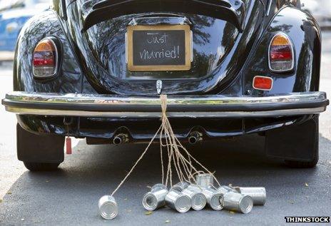 Car with "Just married" and tin cans on bumper