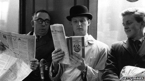 Man reading on the Tube in 1960