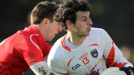 Padraig Rath of Louth challenges Armagh's Jamie Clarke