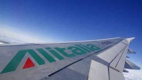 A picture of an Alitalia airplane wing