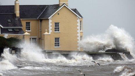 house at Drains Bay is battered by strong winds, rain, and high tide in Co Antrim