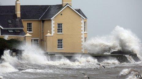 A house at Drains Bay is battered by strong winds, rain, and high tide in Co Antrim