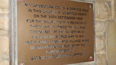 Plaque commemorating service held for the reunion of people who used to live in the village