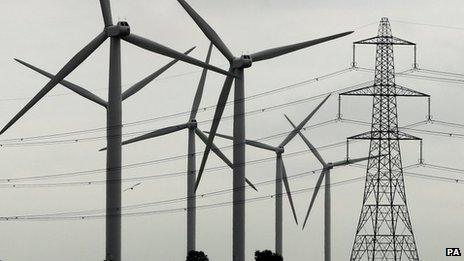 Electricity pylon and wind turbines